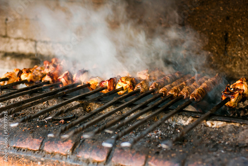 Hot barbecue cooked on fire outdoors