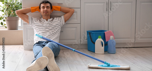 Young man resting after mop...
