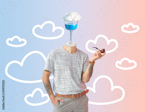 Tattooed man with glass of ...