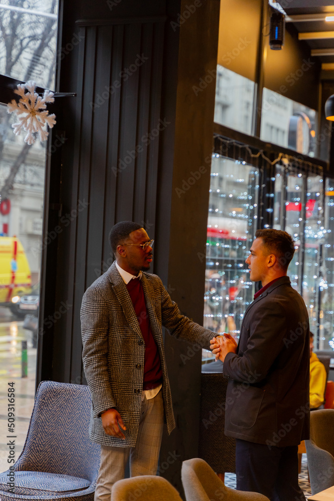 Meeting for the first time while talking and standing in the cafe Meeting for the first time while talking and standing in the cafe