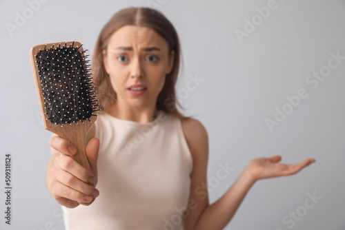 Stressed young woman with h...