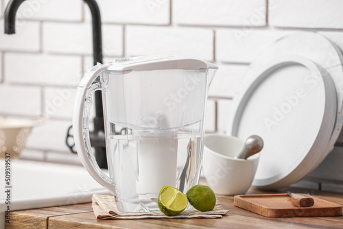 Water filter jug and lime on counter in kitchen