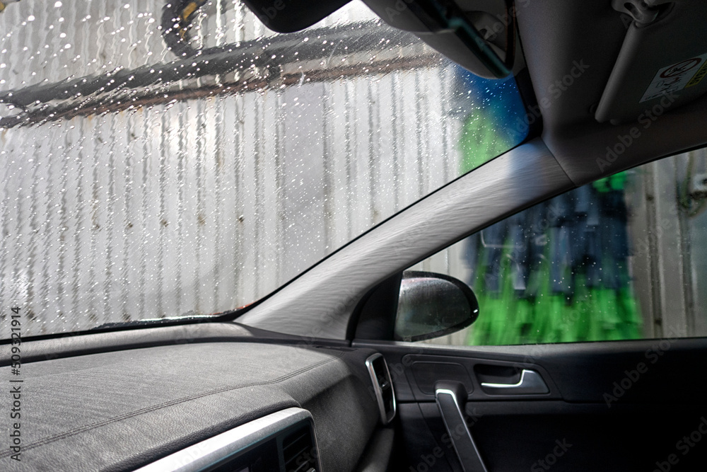 Automatic conveyorized tunnel car wash. A view from inside.
