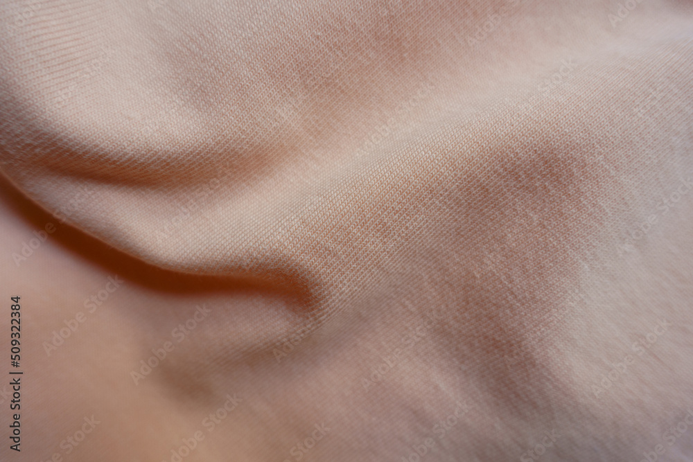 Rippled pale melon pink cotton jersey fabric Rippled pale melon pink cotton jersey fabric