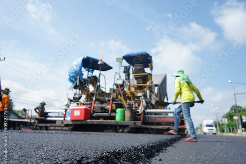 The image is blurred in the construction of asphalt road.