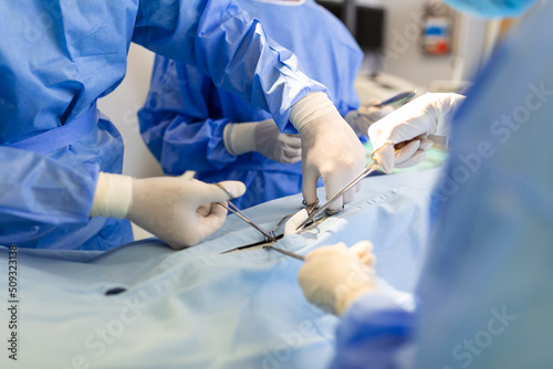 concentrated professional surgical doctor team operating surgery a patient in the operating room at the hospital. healthcare and medical concept.