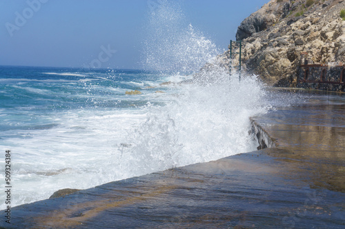 waves crashing against the surf