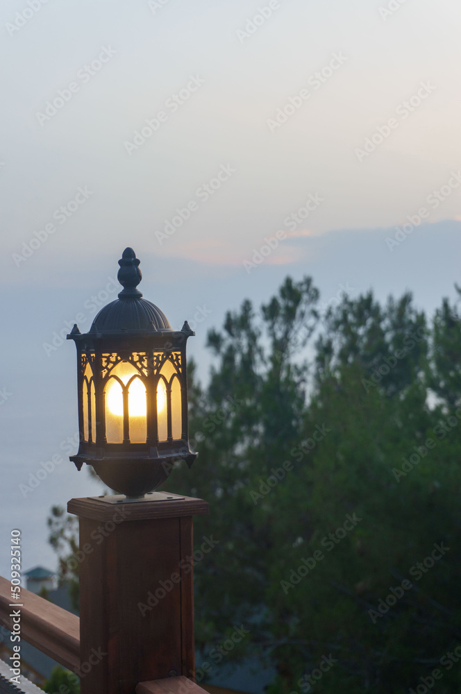 beautiful lantern on the background of the evening sunset