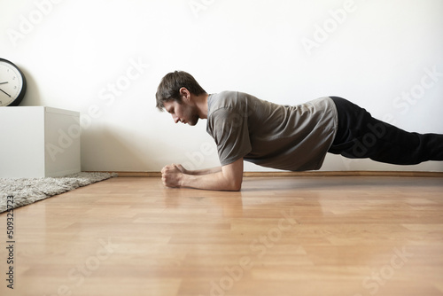 male person doing some fitness exercise activity at home