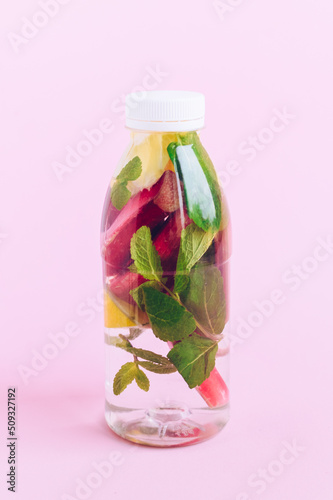 Bottle of detox water with rhubarb, mint and lemon