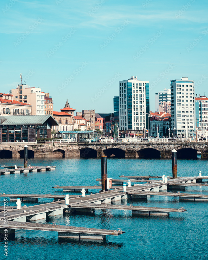 View of the seaport of gijon and its buildings