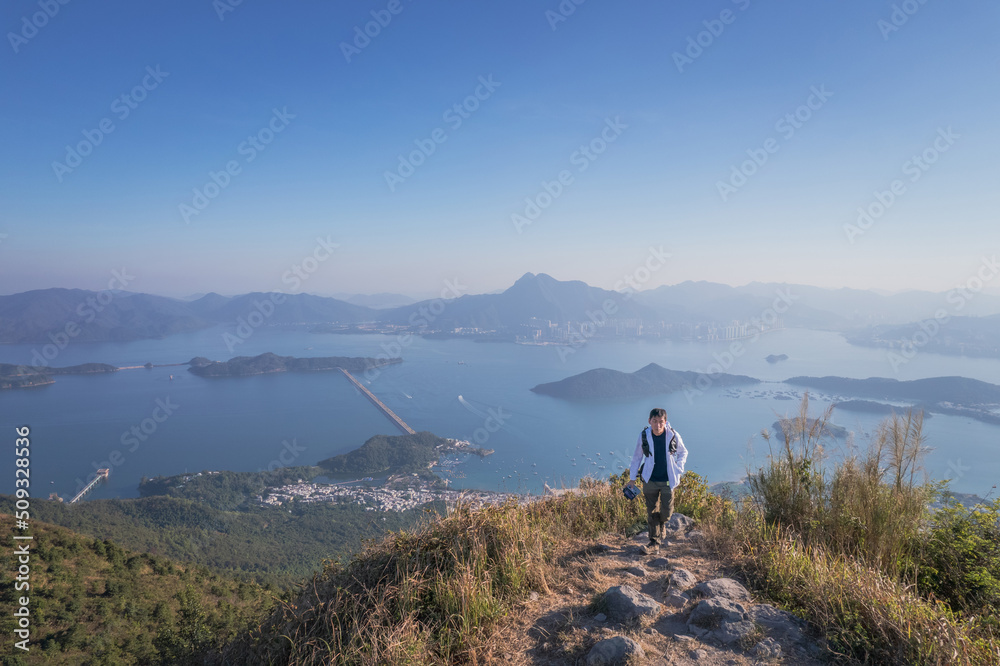 Epic view of hiker man on the mountain of Pat Sin Leng, Tai Po