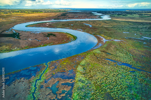 Drone view of different vegetation types and water along the Barwon River and Lake Connewarre near Barwon Heads, Victoria, Australia. photo