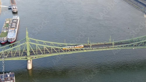 Yellow tram on Liberty bridge in Budapest, Hungary - aerial shot