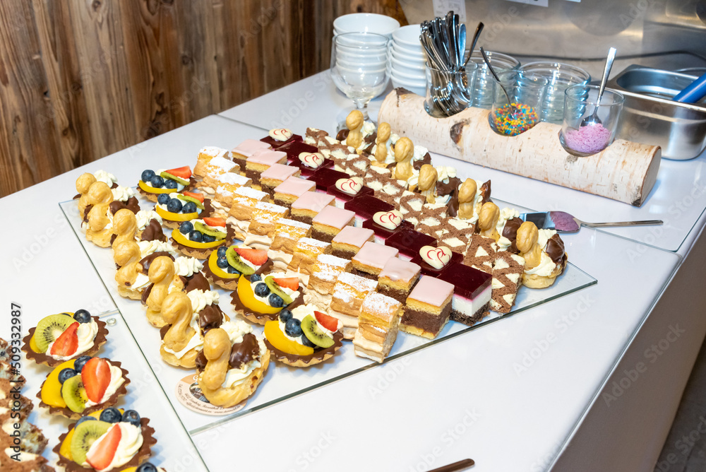 plates filled with pieces of different cakes