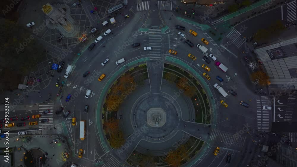 Aerial birds eye overhead top down view of traffic at Columbus Circle. Important intersection in city centre from height. Autumn colour trees around. Manhattan, New York City, USA