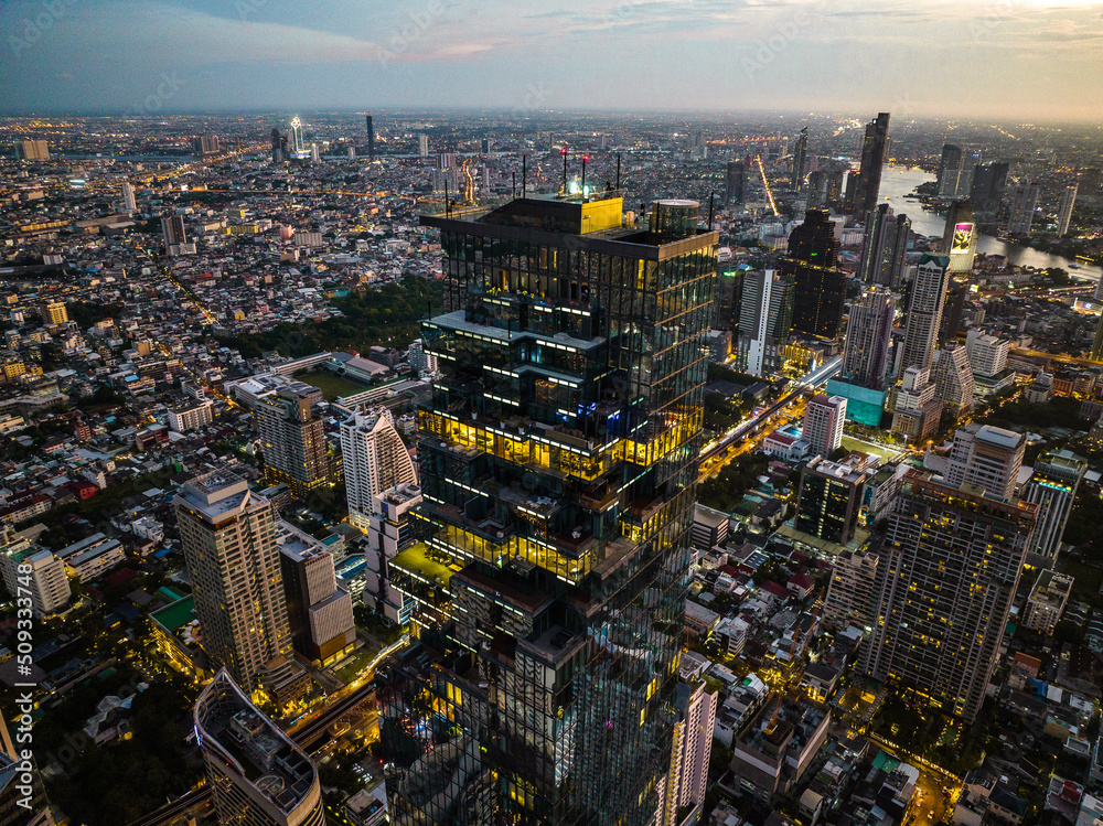 Obraz premium Aerial view of King Power Mahanakhon tower in Sathorn Silom central business district of Bangkok, Thailand