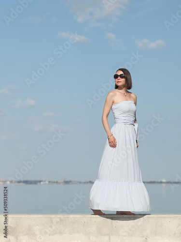 young slender woman by the sea