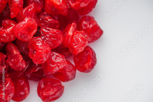 dried cherry berry on a white acrylic background