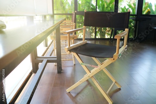 Wooden table with wooden chair in room. Interior and object concept.