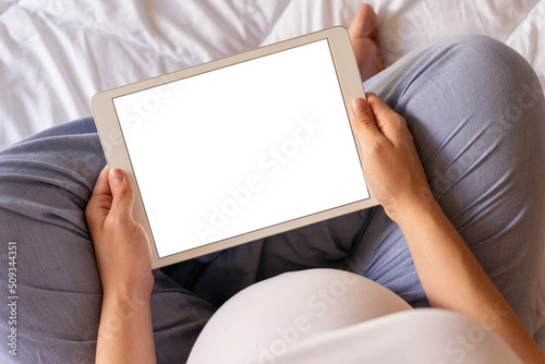 Pregnancy screen mockup. Mobile pregnancy online maternity application mock up. Pregnant mother using phone. Concept of pregnancy, maternity, expectation for baby birth. © Maksym