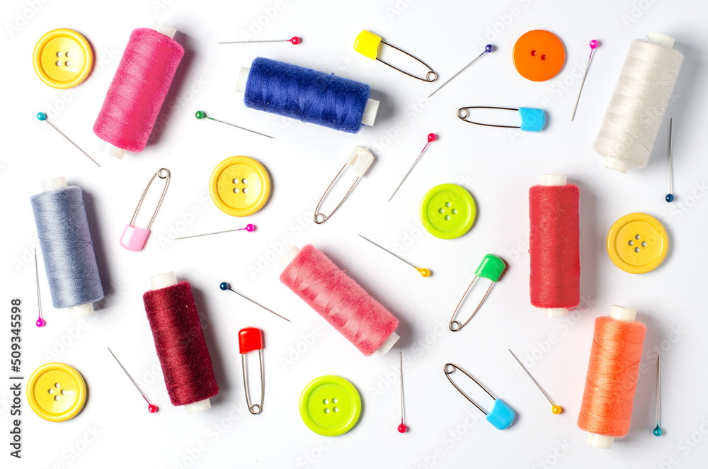 Accessories for sewing on a white background. Closeup. Accessories for sewing on a white background. Closeup.