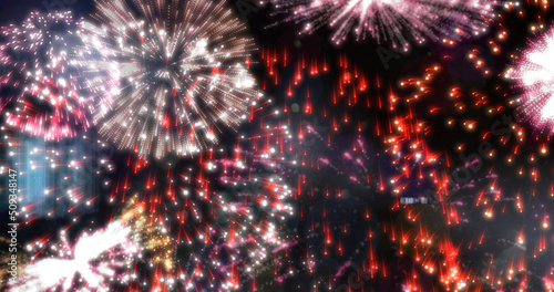 Image of exploding red and white fireworks scrolling on black background