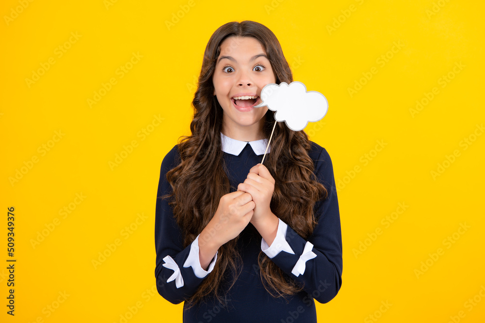 Teenager child girl holding thinking bubble, comment cloud over yellow background. Teenager child girl holding thinking bubble, comment cloud over yellow background.