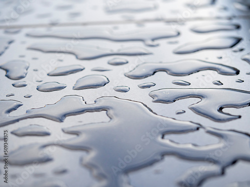 Abstract background of water droplets on the surface. Beautiful background with bokeh, blurred image © Наталья Майшева