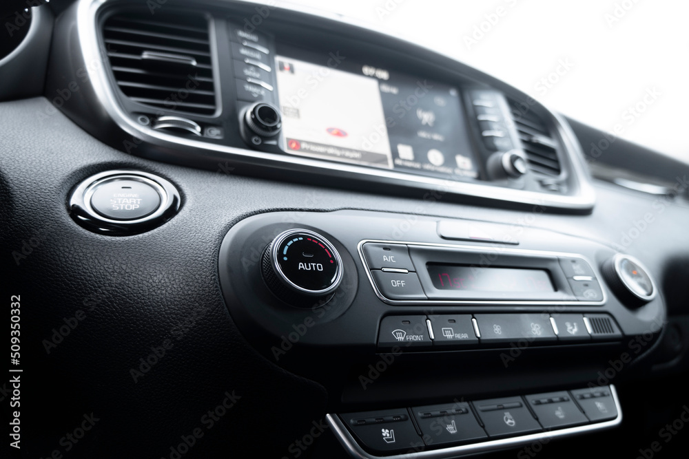 Air conditioning button inside a car. Climate control AC unit in the new car. Modern car interior details. Car inside. Car interior