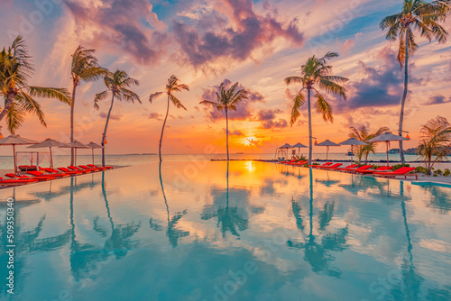 Fotografija Tropical sunset over outdoor infinity pool in summer seaside resort, beach landscape