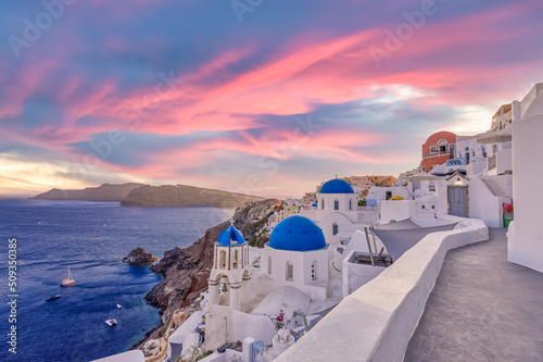 Fototapeta Naklejka Na Ścianę i Meble -  Sunset night view of traditional Greek village Oia on Santorini island in Greece. Santorini is iconic travel destination in Greece, famous sunset point landscape and traditional white architecture