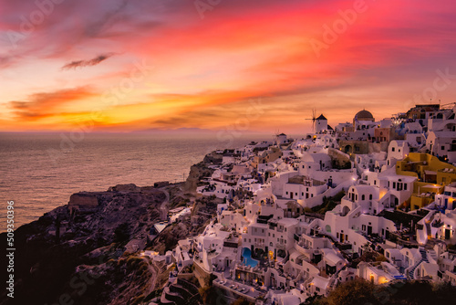 Sunset night view of traditional Greek village Oia on Santorini island in Greece. Santorini is iconic travel destination in Greece, famous sunset point landscape and traditional white architecture © icemanphotos