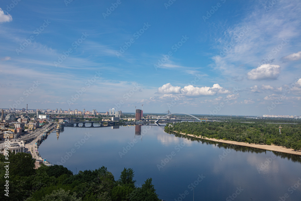 View on Dnipro river from pedestrian and bicycle bridge across Saint Volodymyr descent  in Kyiv, Ukraine