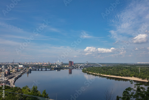 View on Dnipro river from pedestrian and bicycle bridge across Saint Volodymyr descent in Kyiv, Ukraine