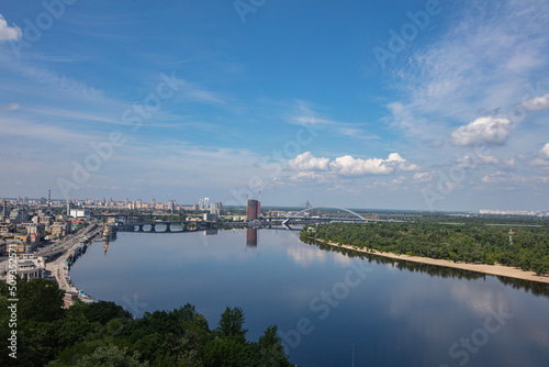 View on Dnipro river from pedestrian and bicycle bridge across Saint Volodymyr descent  in Kyiv, Ukraine © Ruslan