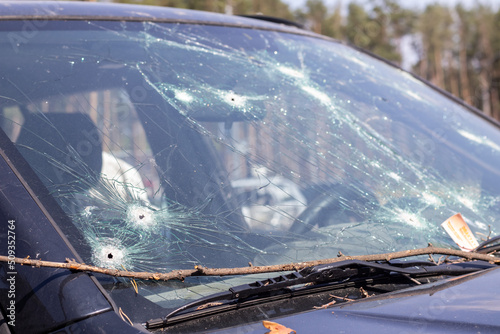 Fotobehang Holes on the windshield of the car, it was shot from a firearm