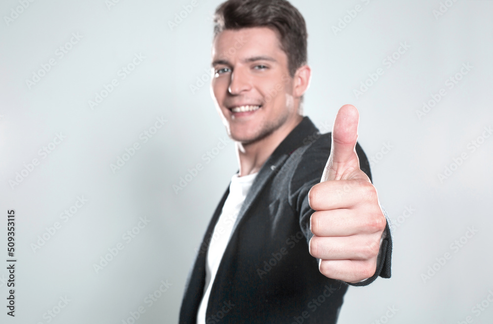 Cool businessman standing on grey background Cool businessman standing on grey background