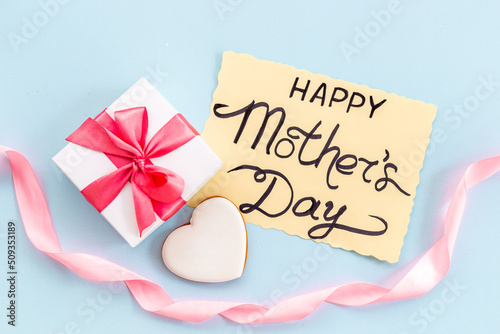Women mothers day concept with pink ribbon fift box photo