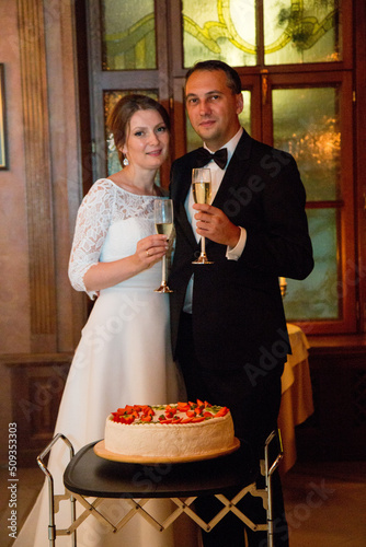 Wedding cake 40 year old bride and groom in a restaurant