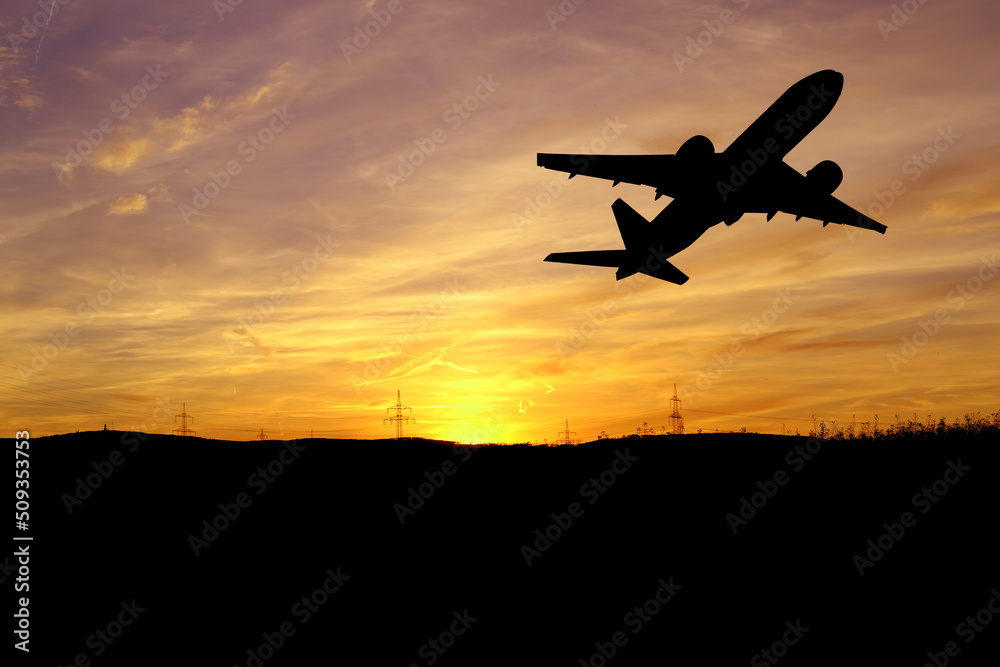 sunset in evening beautiful colorful dramatic sky with cloud, background light sky gradient with airplane trail lines, power towers, concept of heavenly space, meditative calmness and greatness