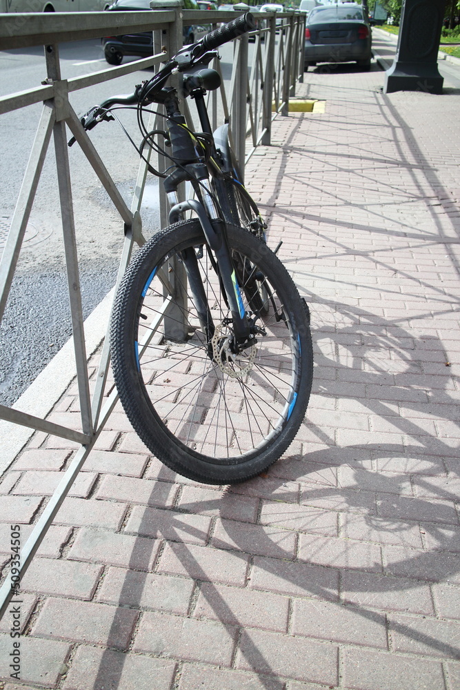 bicycle at the road barrier in the city