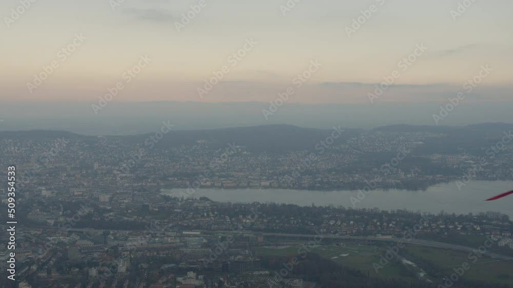 Paraglider flying through a city landscape - close. Paraglider flying through a city landscape - close.