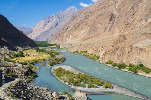 Gilgit river, tributary of the Indus river, flowing through the beautiful mountain valley in the Karakorum mountains in Pakistan © Анастасия Смирнова