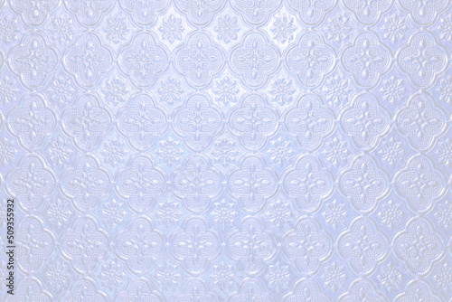 Textured pale blue purple shiny light background with a B pattern of painted glass in vintage style wall