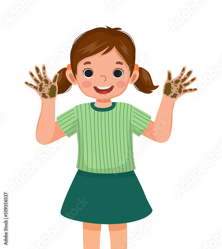 cute little girl showing her dirty hands with mud and soil dirt