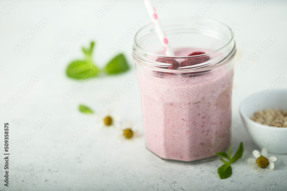 Healthy raspberry smoothie in the jar