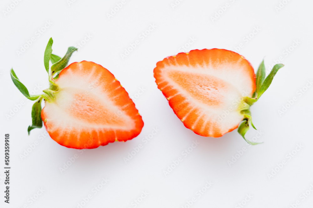 Close up view of cut strawberry on white background. Close up view of cut strawberry on white background.