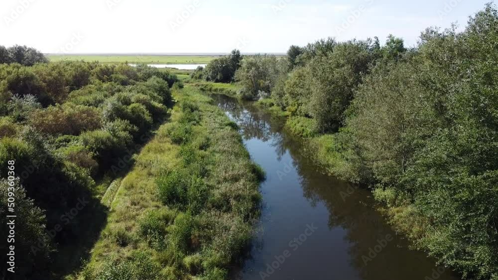 Aerial Establisher From Blue River To Large Open Field, Drone Shot Aerial Establisher From Blue River To Large Open Field, Drone Shot