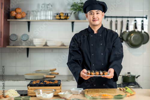 Fotografie Portrait of chef cooking japanese food